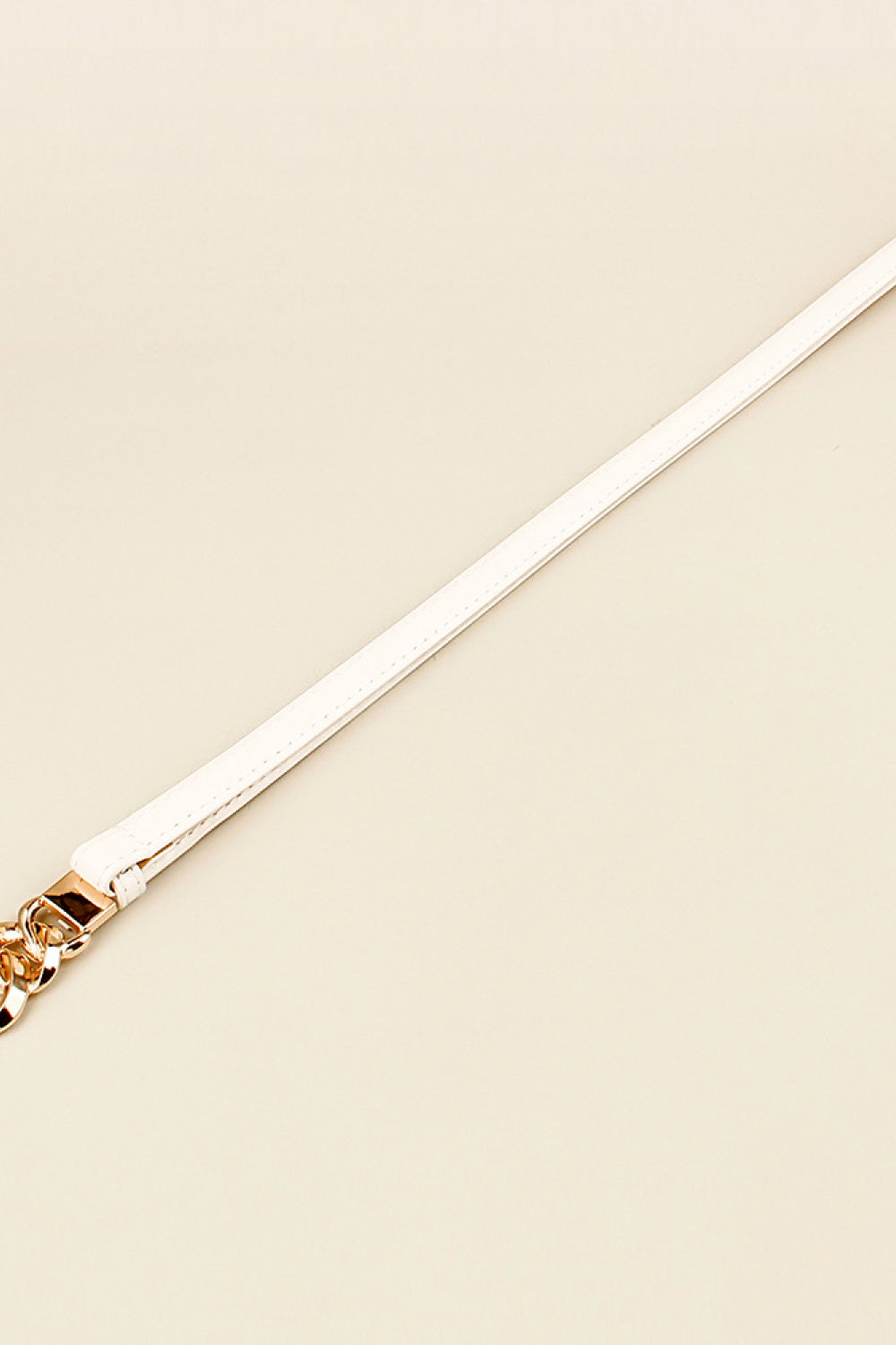 Skinny vegan leather belt with gold-tone buckle hardware, white strap