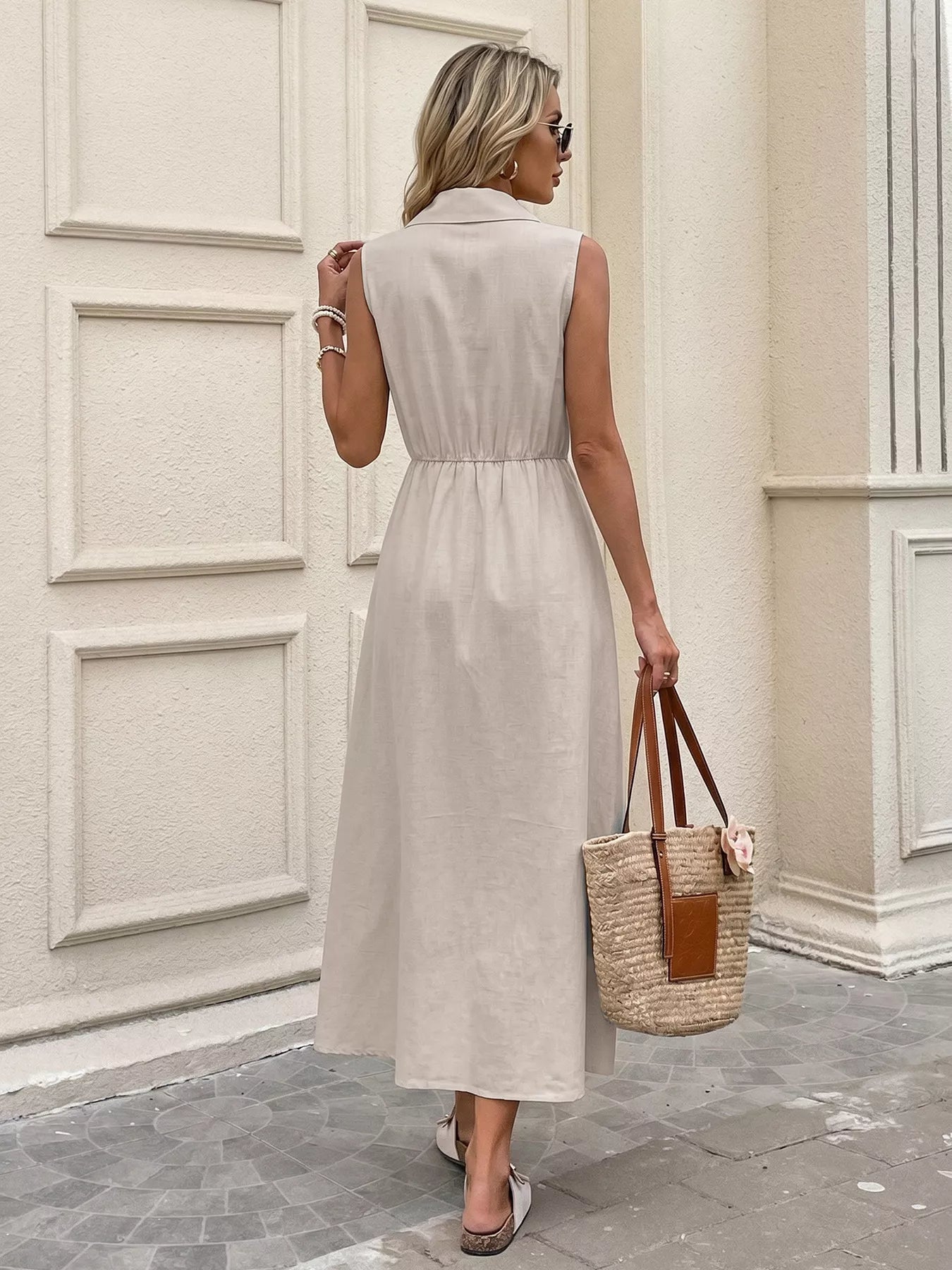 Cedar & Moore sleeveless button-down midi dress in beige with cinched waist and side slit
