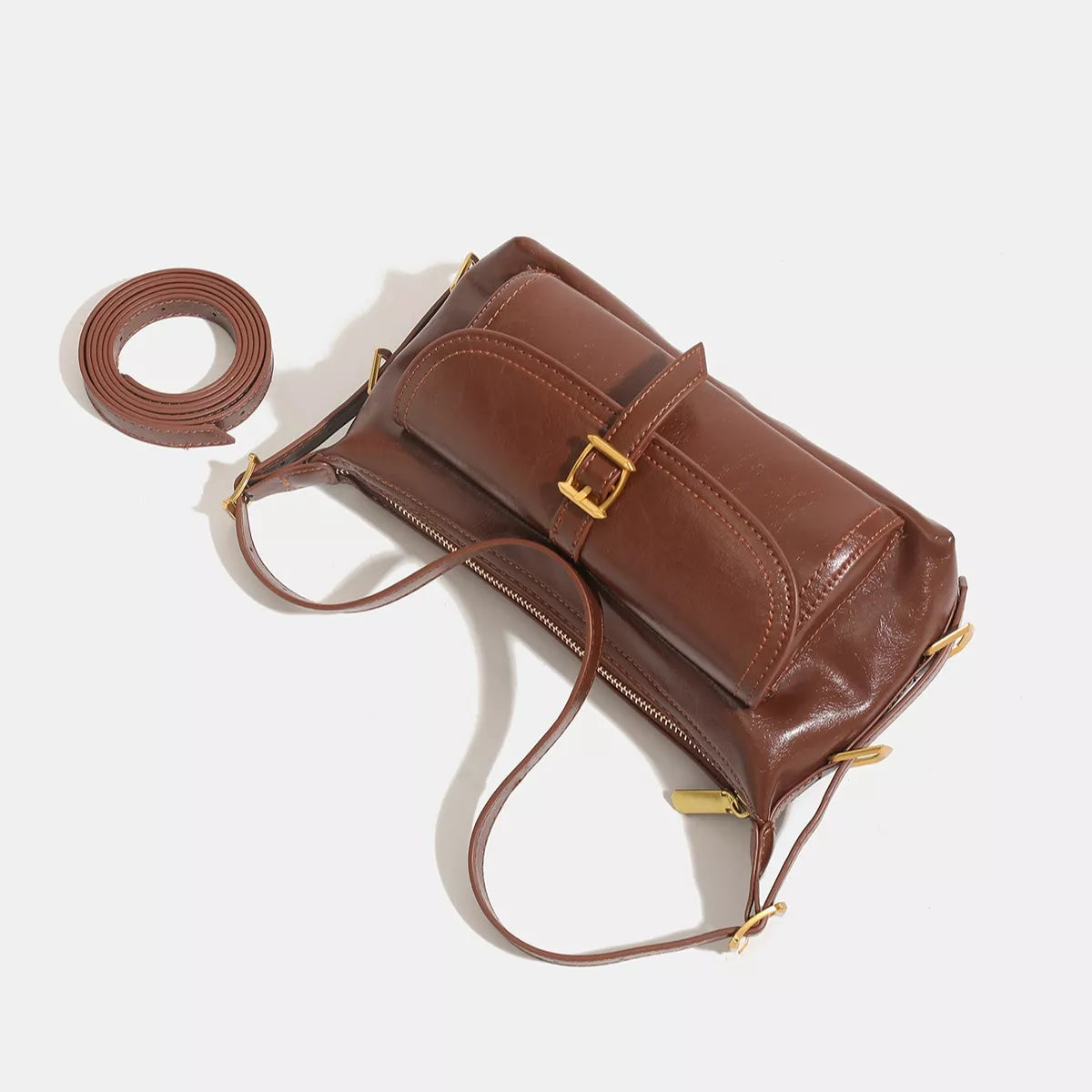 Caramel vegan leather shoulder bag with buckle front and matching shoulder strap