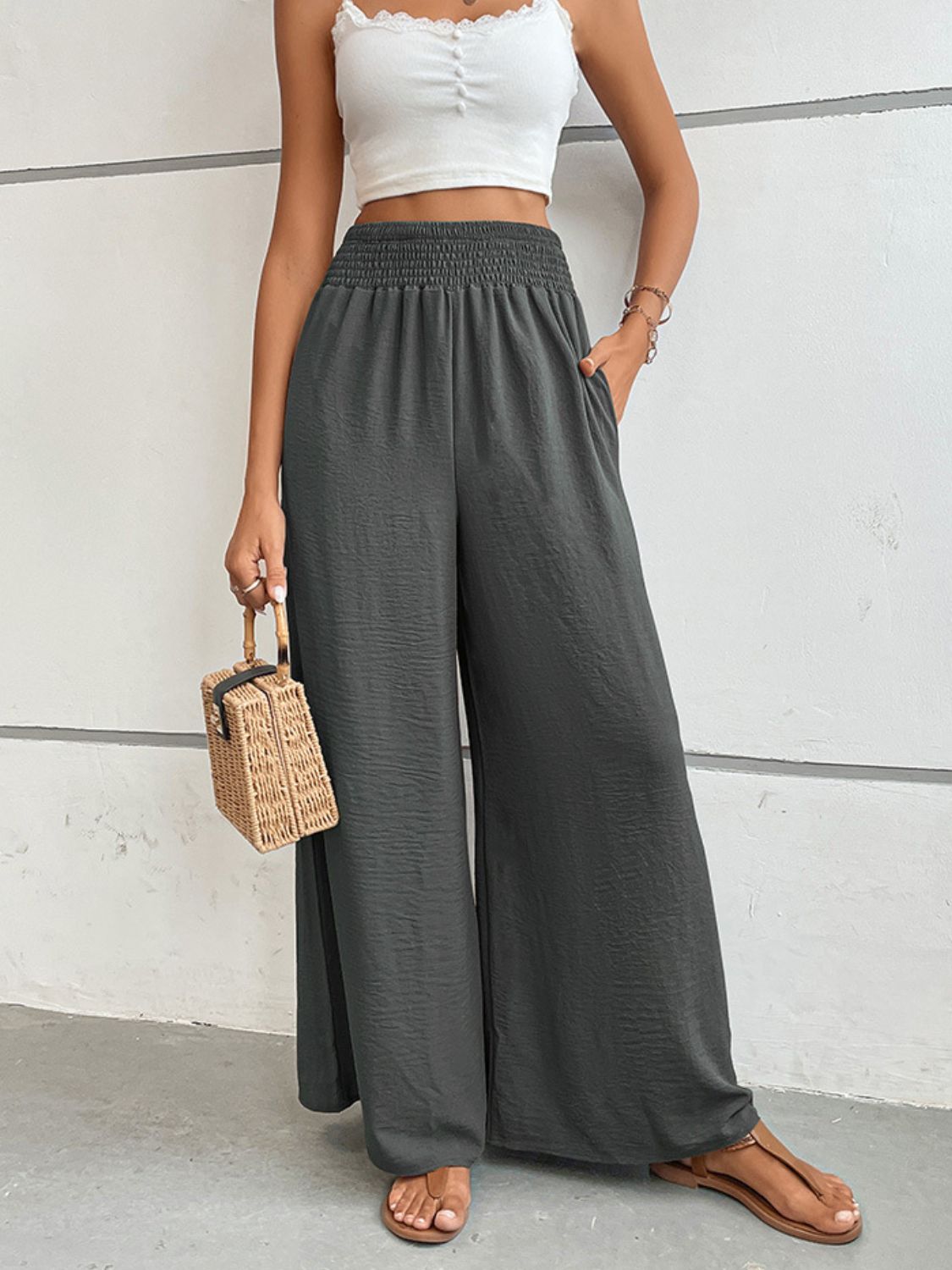 Dark gray wide-leg long pants with elastic waistband and relaxed, drapey fit