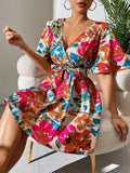 Trendsi Printed Surplice Short Sleeve Mini Dress with colorful floral wrap and waist belt