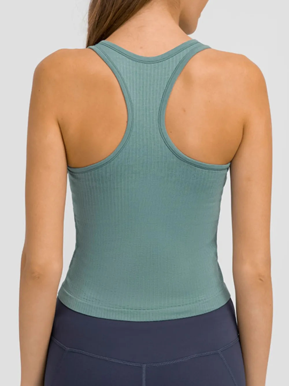 Turquoise active tank top with racerback back view and scooped neckline opening.