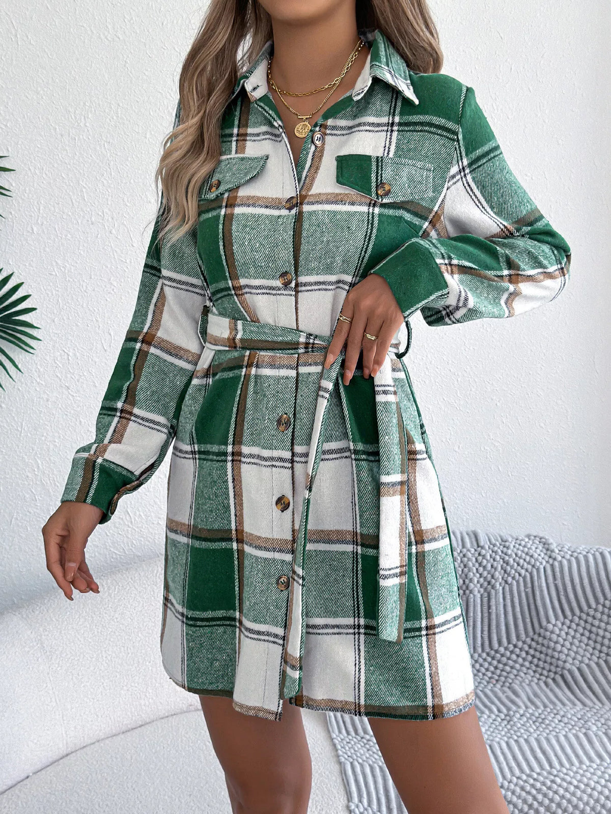 Green plaid belted button shirt dress with long sleeves and tied waist belt