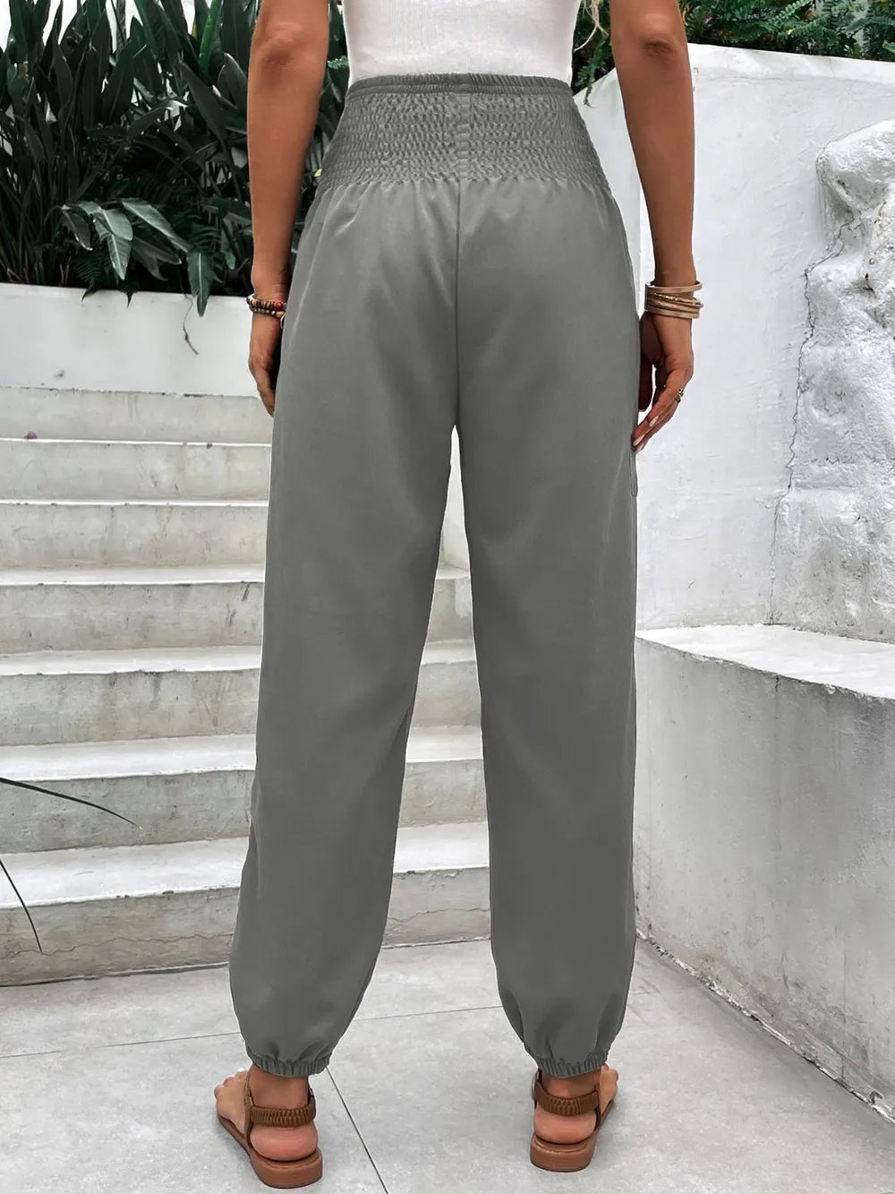 Smocked high-rise joggers with side pockets, gray elastic waistband and cuffs