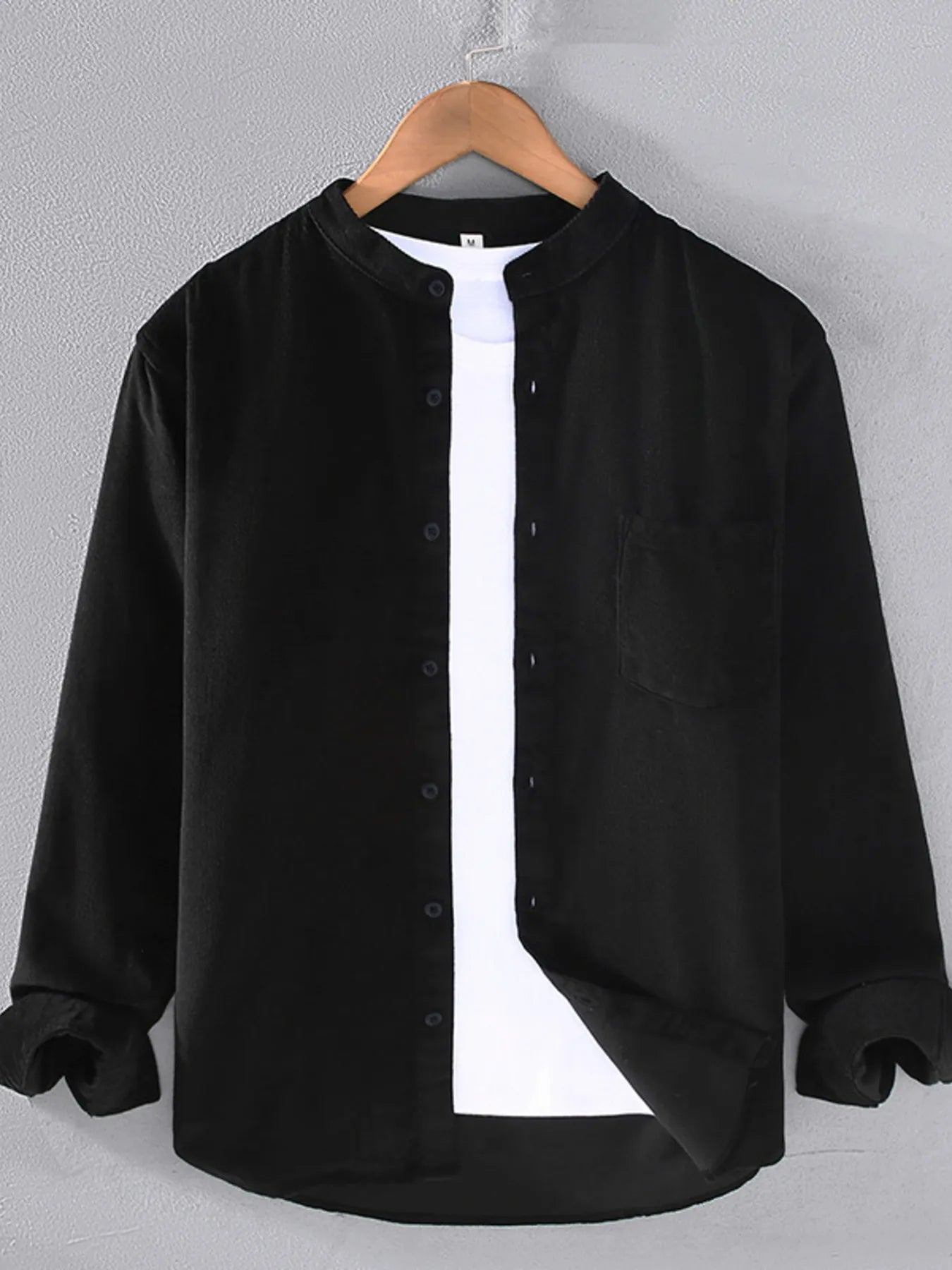 Men's long-sleeve button-up shirt in black, with front buttons and chest pocket