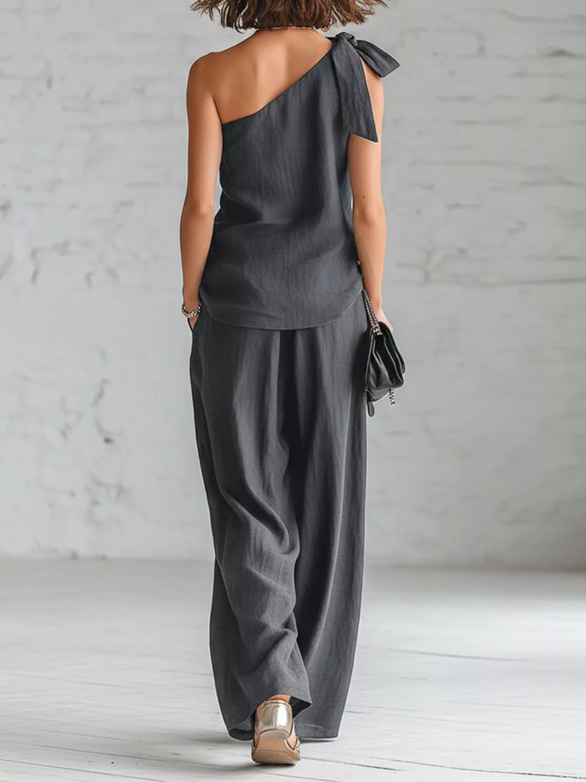 Gray one-shoulder bow top and wide-leg pants set, back view