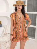 Printed V-neck cap sleeve romper in orange with ornate border print and shorts