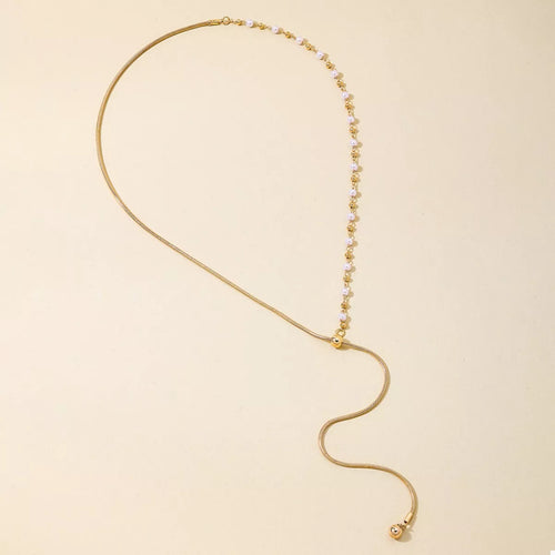 Gold-plated Y-shaped necklace with white pearl-bead strand and long loop drop