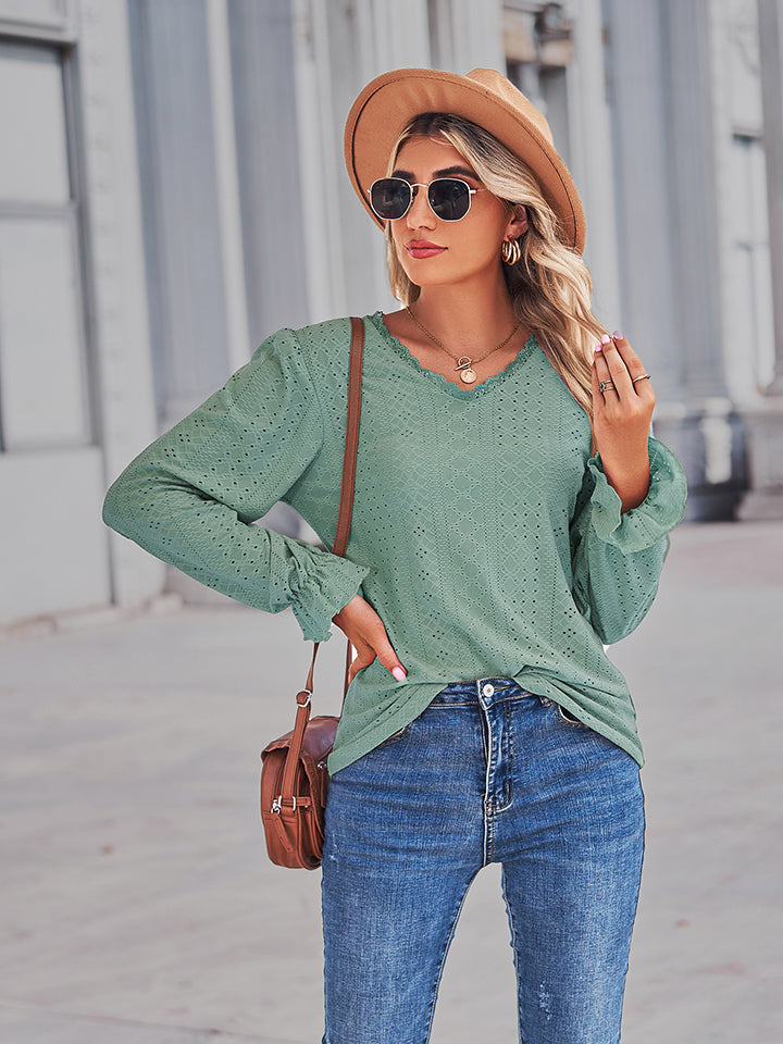 Gum leaf green eyelet V-neck blouse with flounce cuffs and relaxed fit, side view