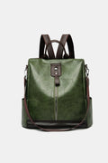 Dark green vegan leather backpack bag with front zipper and top handle straps