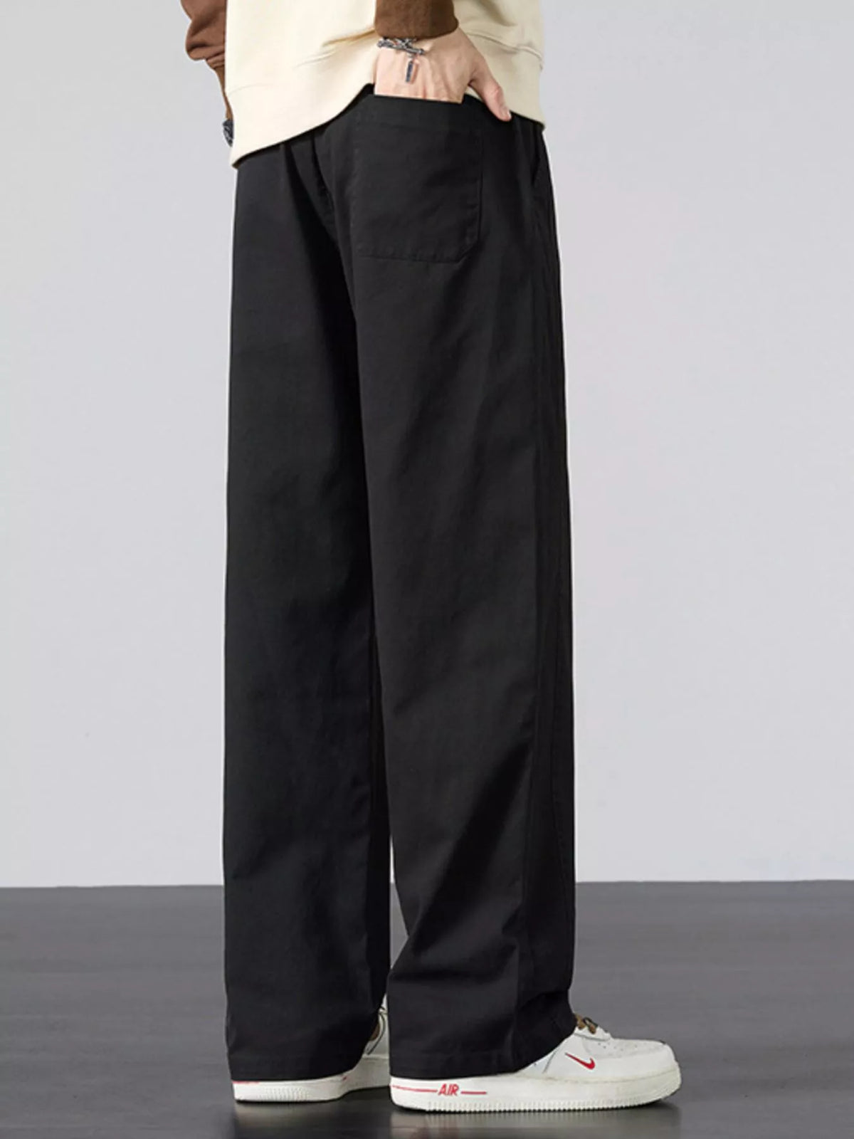 Men's wide-leg drawstring casual pants, black with side pockets and relaxed fit.