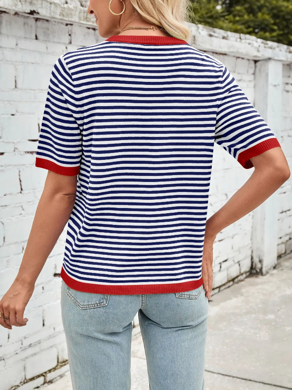 Back view of navy and white striped knit top with red contrast trim and half sleeves
