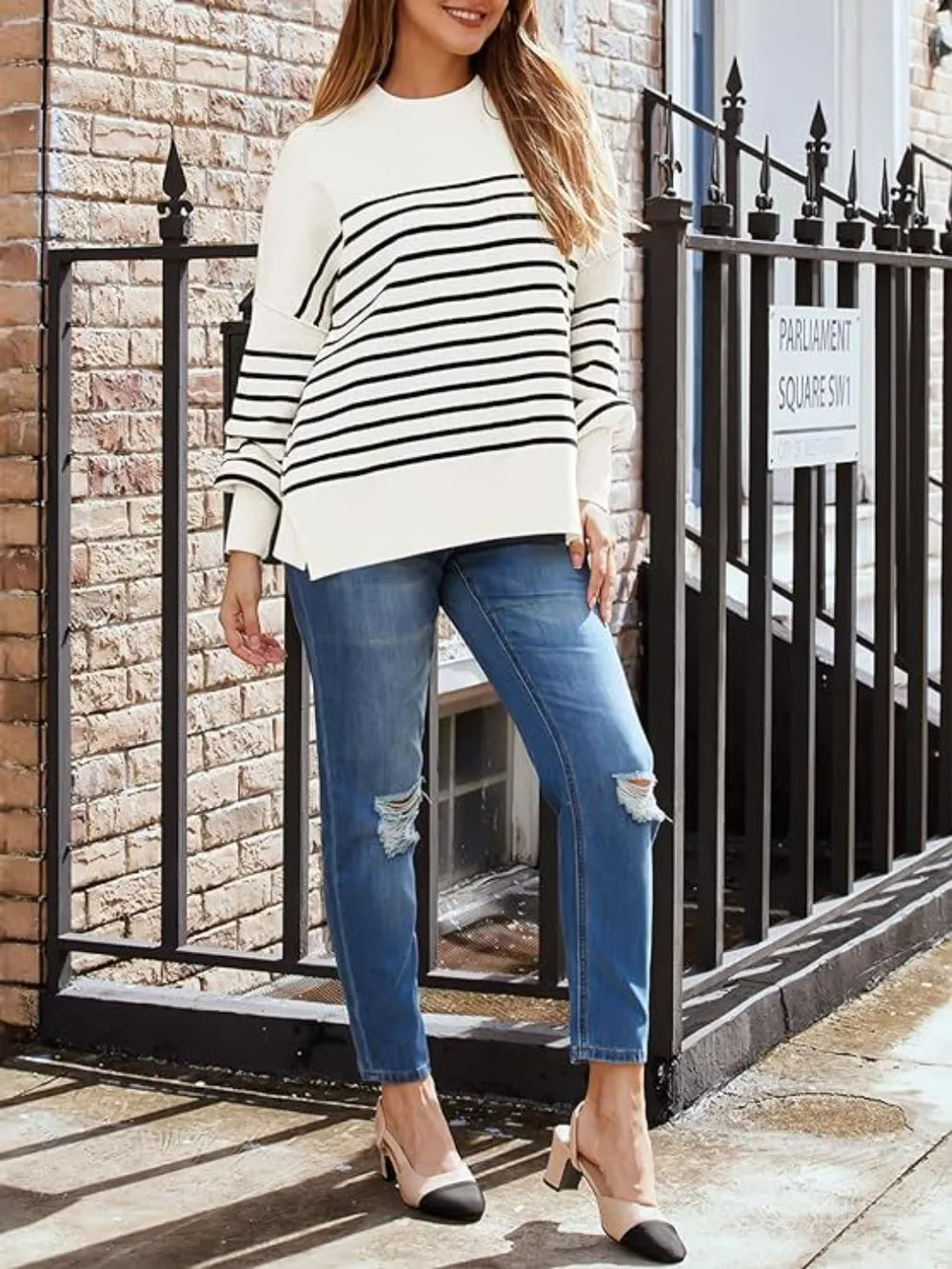 Tan long-sleeve sweatshirt with round neck and black-and-white horizontal stripe design