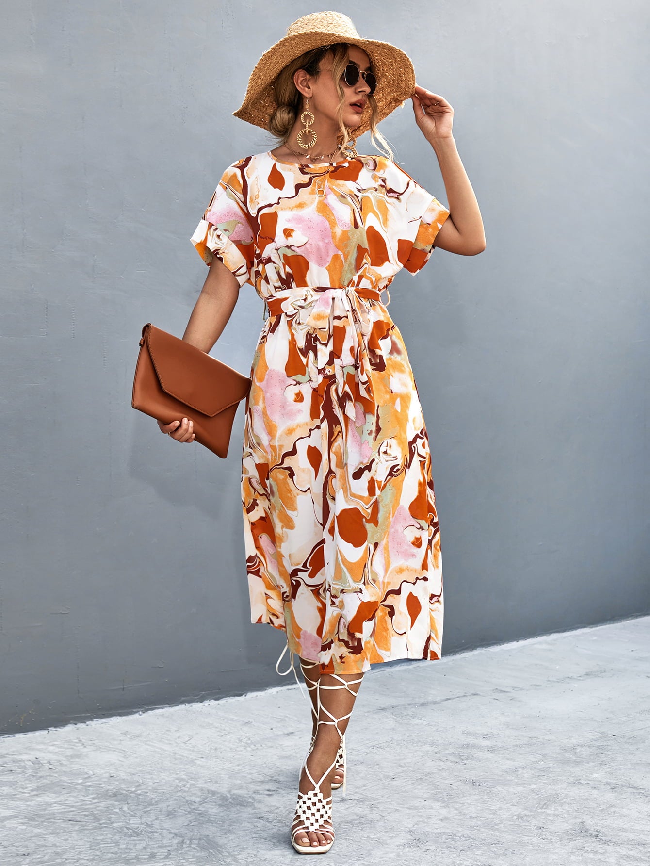 Orange-red abstract midi tie-waist dress with round neck, short sleeves, and side slit