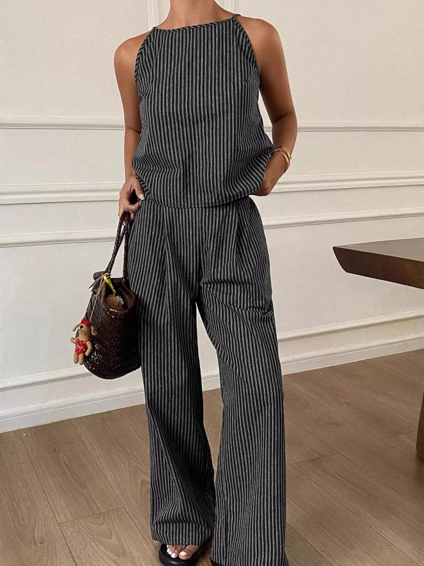 Black striped sleeveless top and wide-leg pants set, high neck and relaxed wide legs