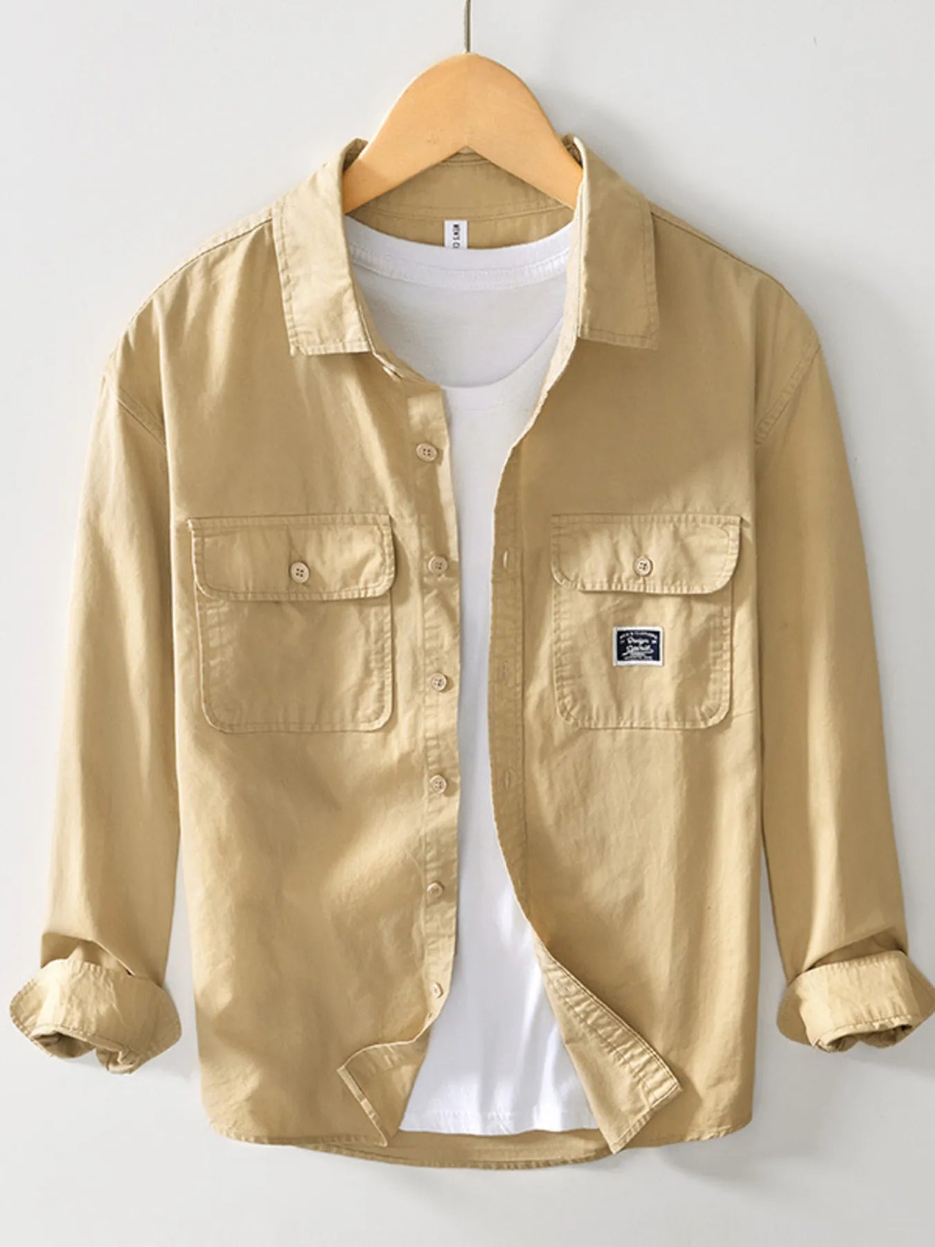 Apricot button-up long sleeve shirt with chest pockets and button placket