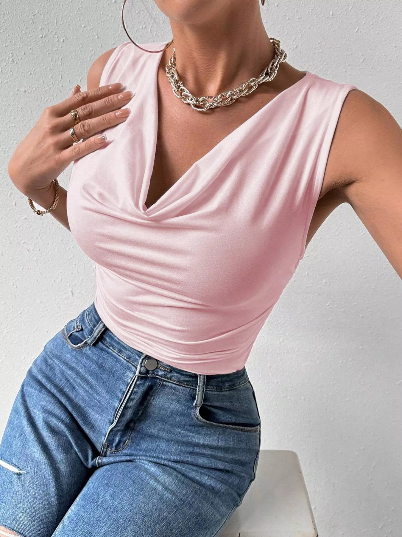Pink cowl-neck tank top with draped, ruched front and sleeveless design