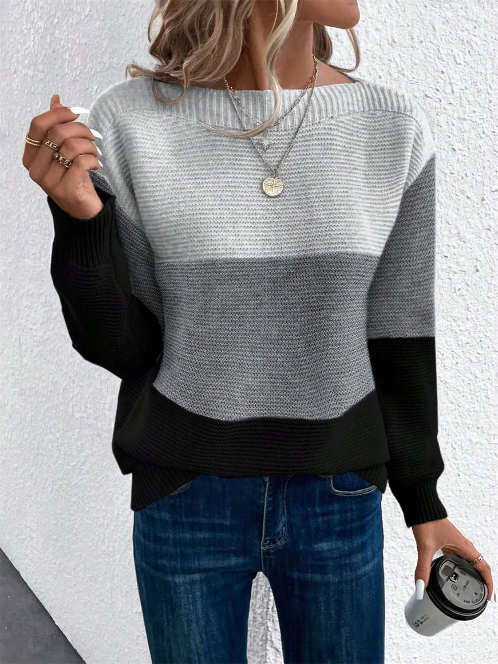 Women’s color block sweater with cream, gray, and black sections, long sleeves