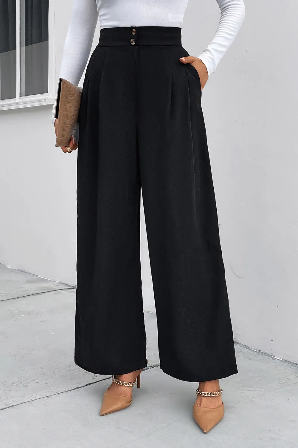 Black wide-leg pants with high waist, pleats, and button closure