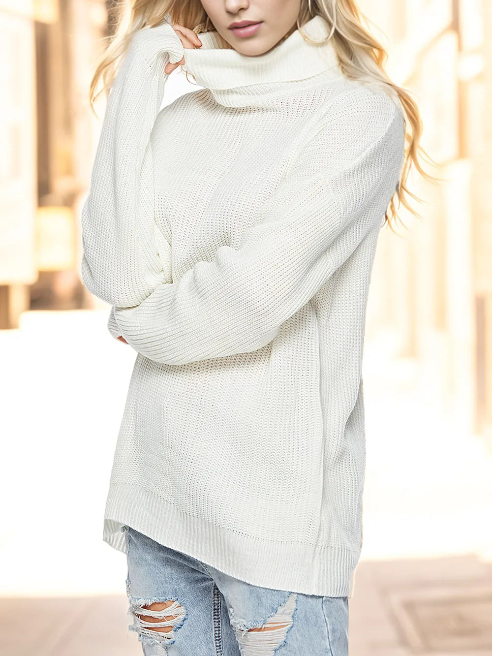 White turtleneck drop-shoulder sweater with cozy knit texture and long sleeves