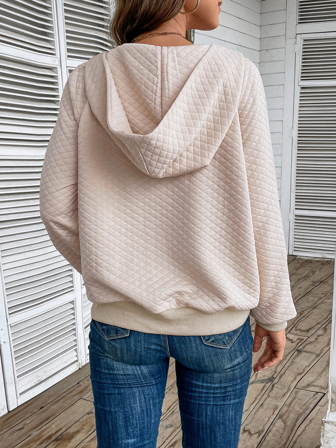 Cream quilted half-zip hoodie with hood, back view, long sleeves