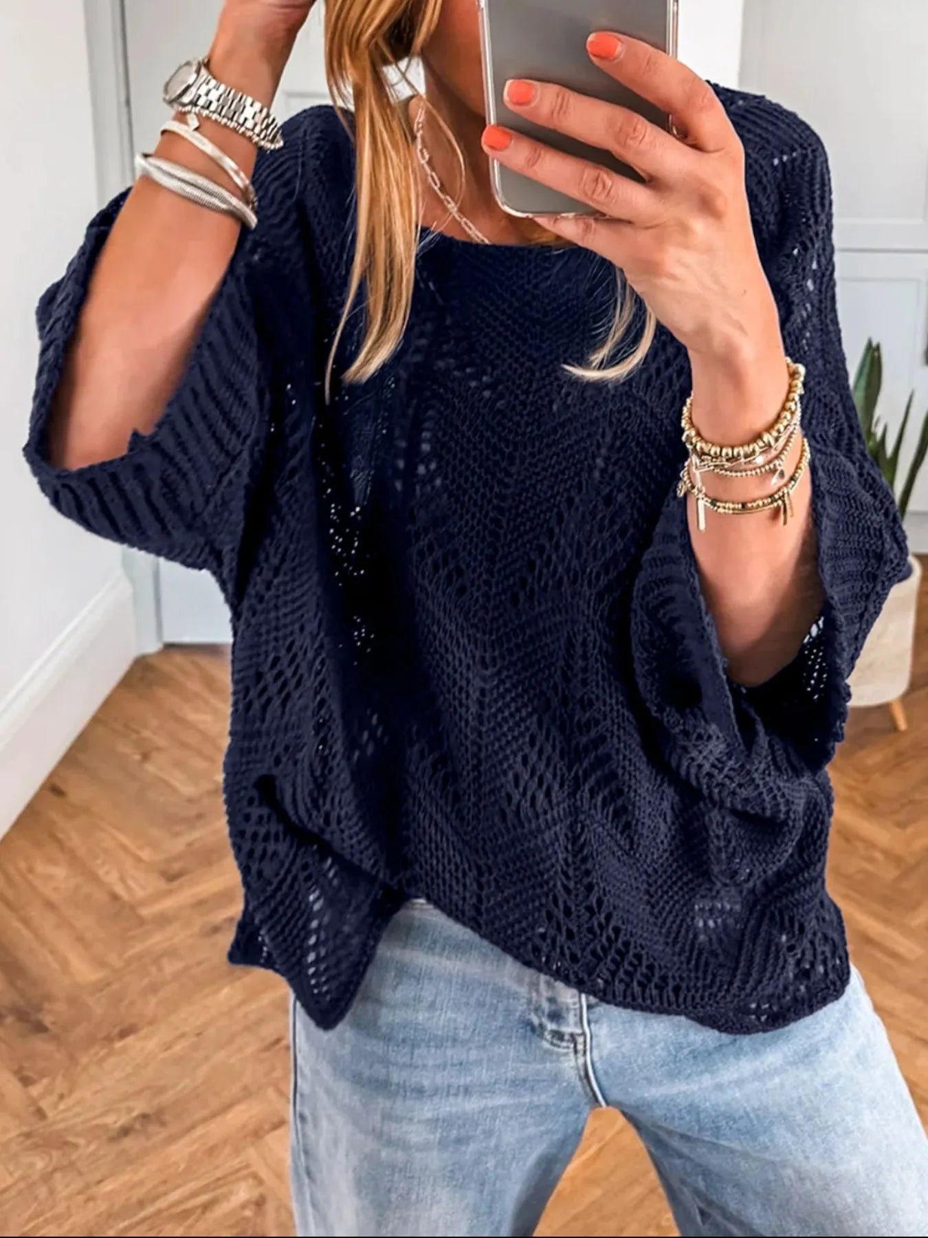 Navy crochet long-sleeve sweater with textured knit pattern and relaxed fit