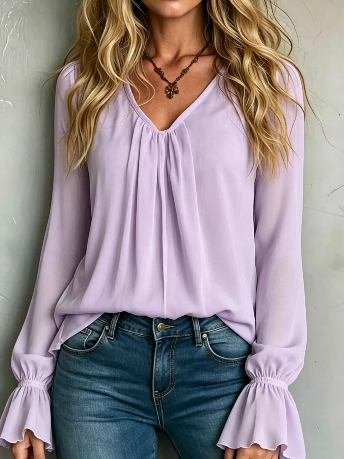 Women’s v-neck polyester blouse in pink purple with flounce bell sleeves and pleated front