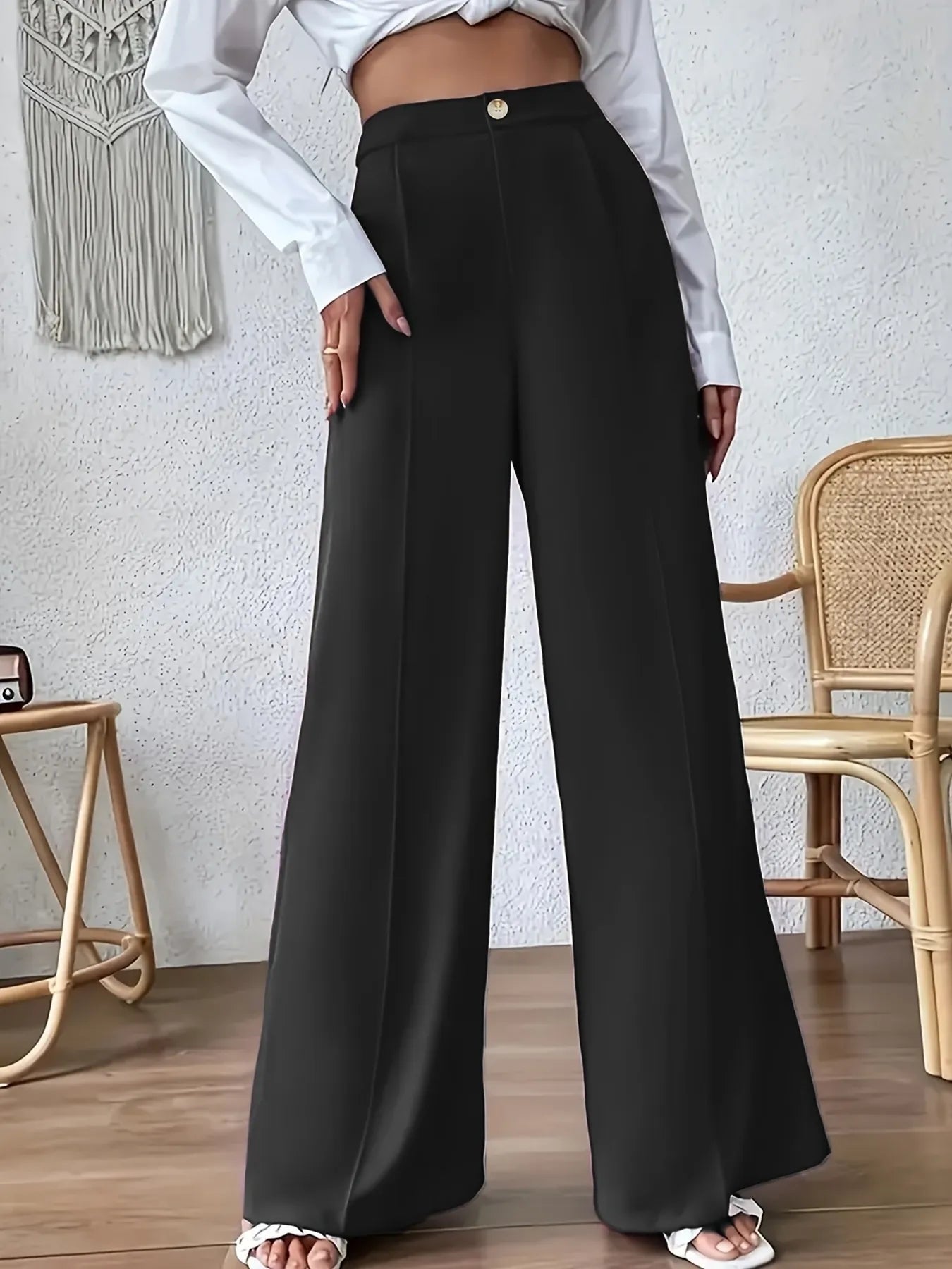Black high-waist wide-leg pants with relaxed wide legs and front button