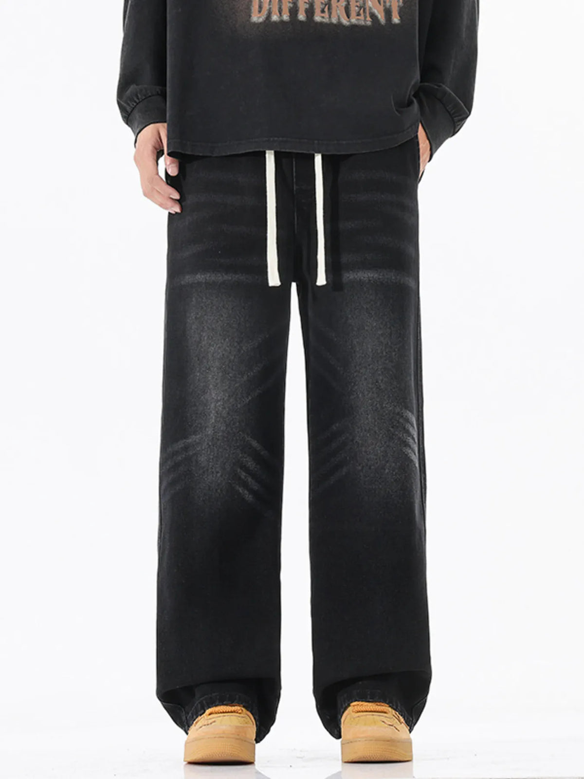 Men's black wide-leg cotton jeans with drawstring tie waist and relaxed straight fit