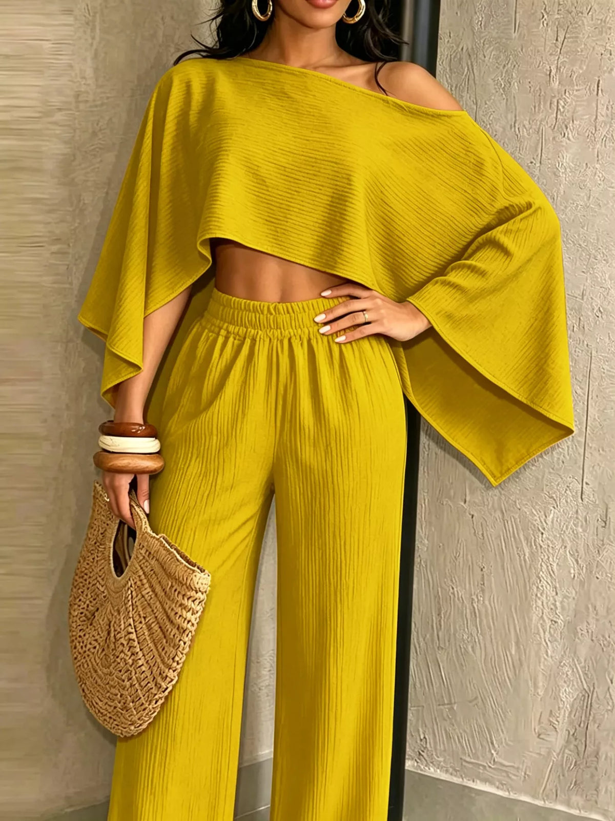Yellow boat-neck crop top with dolman sleeves and matching wide-leg pants