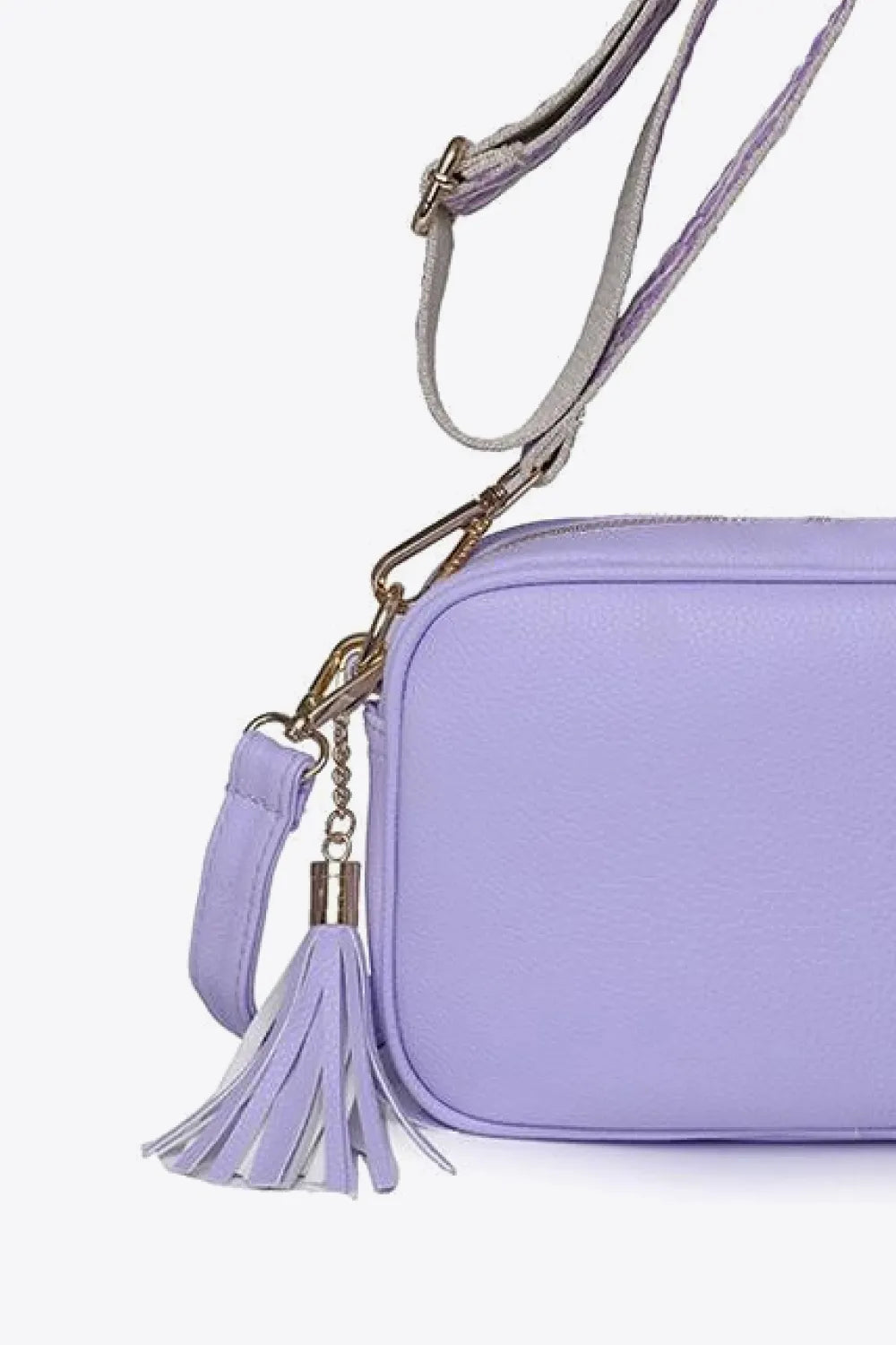 PU leather tassel crossbody bag, lavender side view with gold chain and tassel