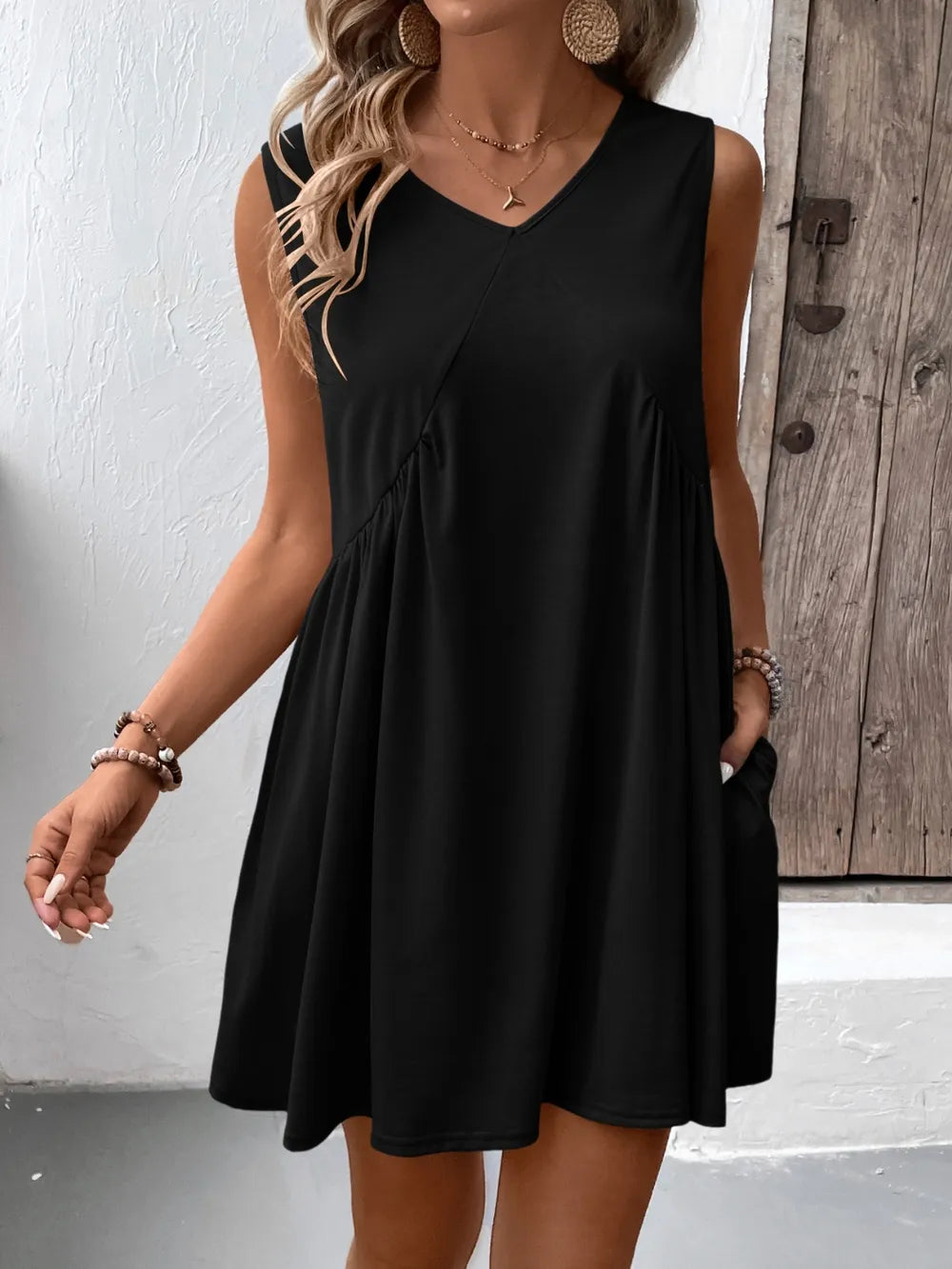 Ivy Lane ruched V-neck sleeveless mini dress in black by Trendsi.