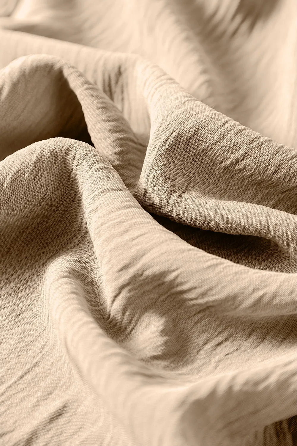 Khaki jumpsuit fabric drape with soft gathered texture