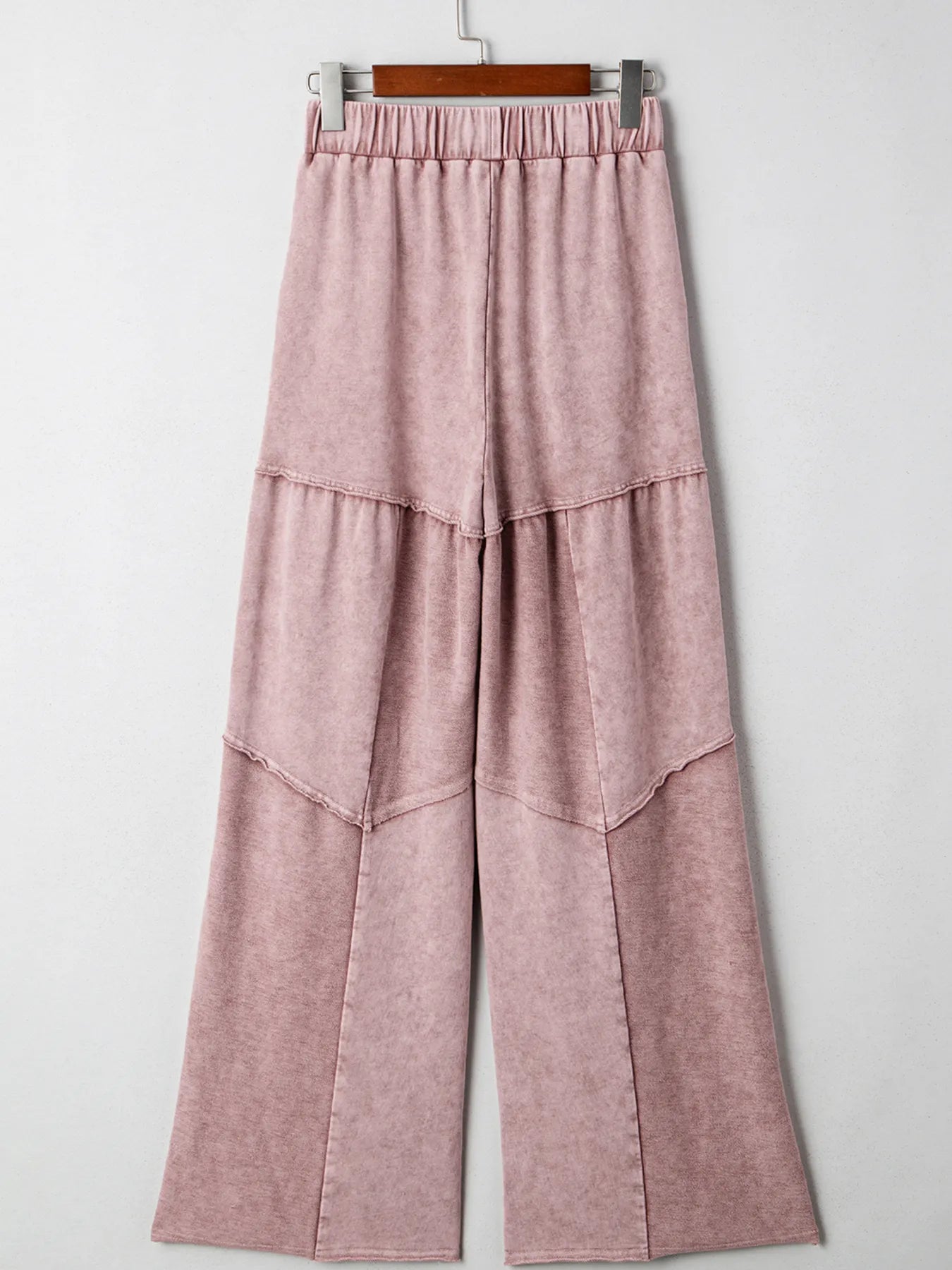 Dusty pink tiered wide-leg pants with patch pockets and drawstring elastic waistband