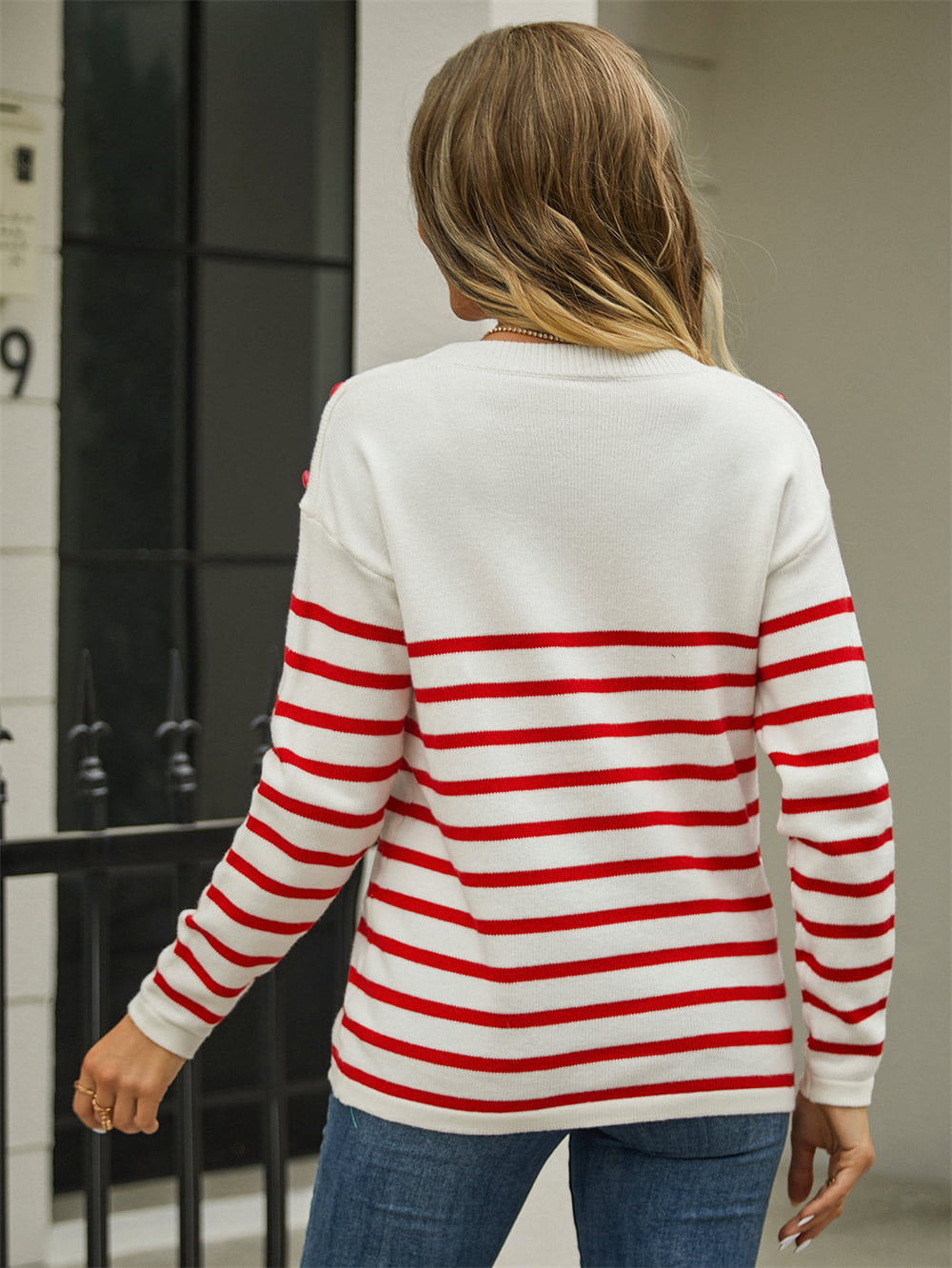 White pullover sweater back with red horizontal stripes and round neck