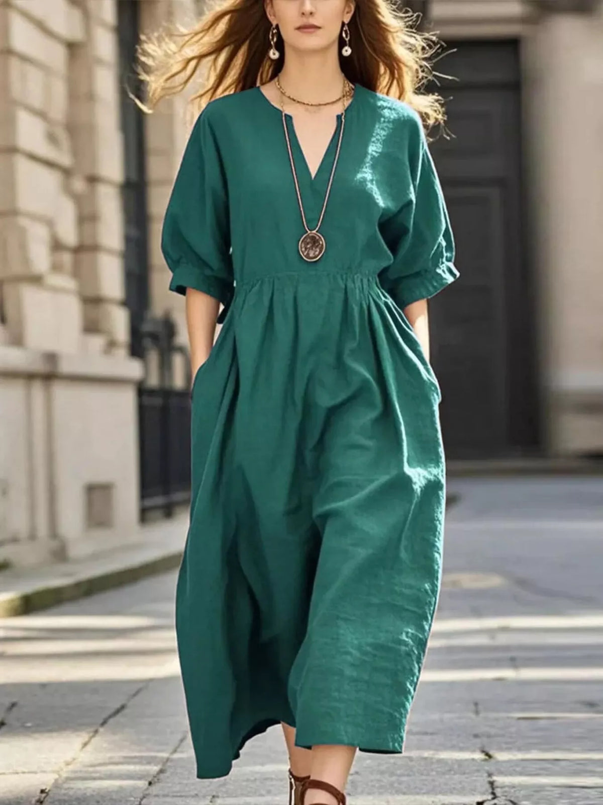 Green notched V-neck midi dress with half sleeves and gathered waist