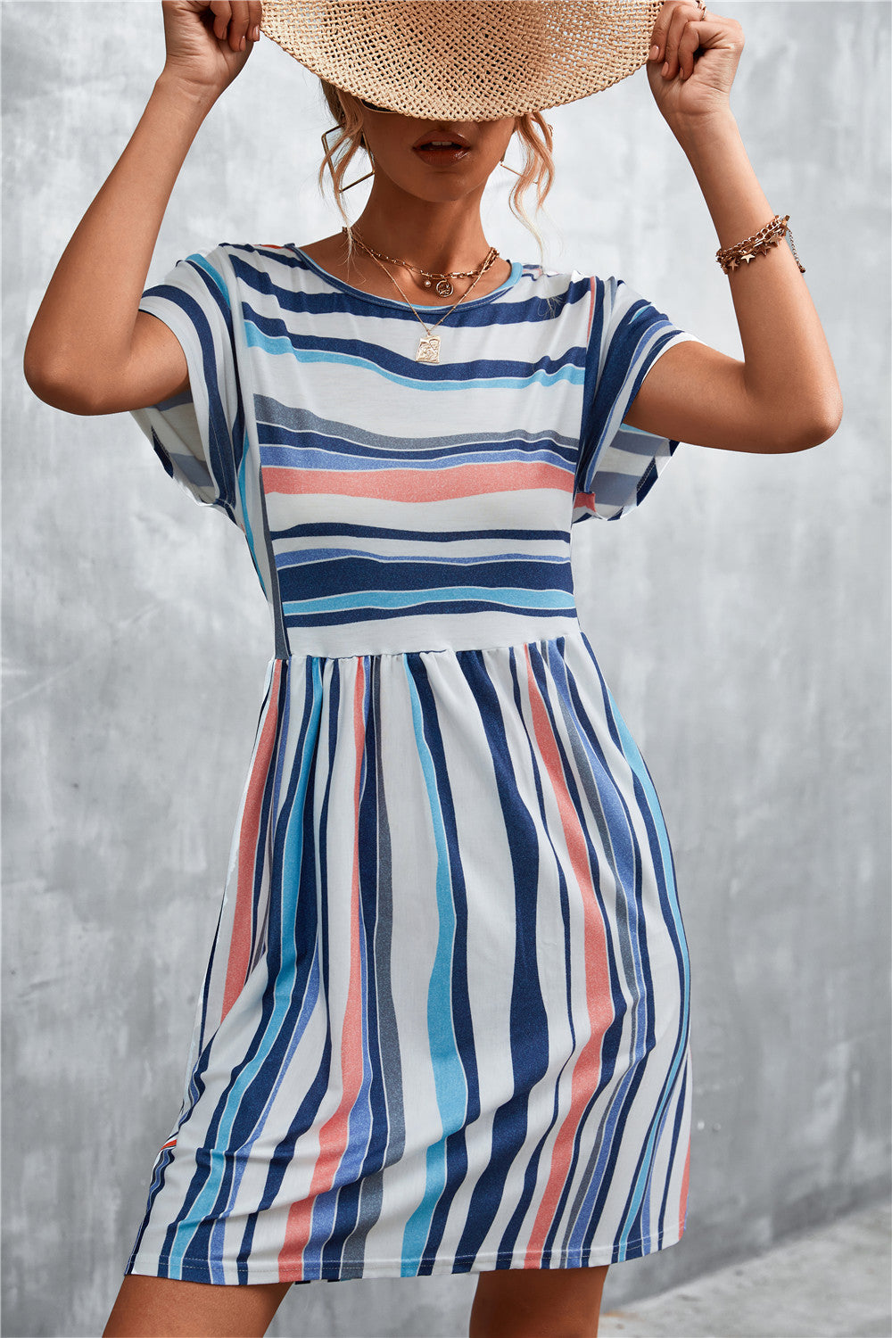 Striped round-neck dress with short sleeves, blue-and-white vertical stripes, gathered waist