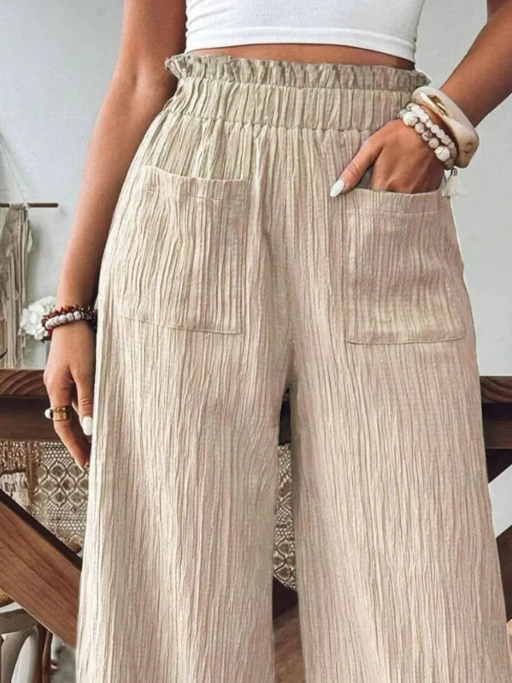 Frill wide-leg pants in beige with ruffled elastic waist and stitched side pockets