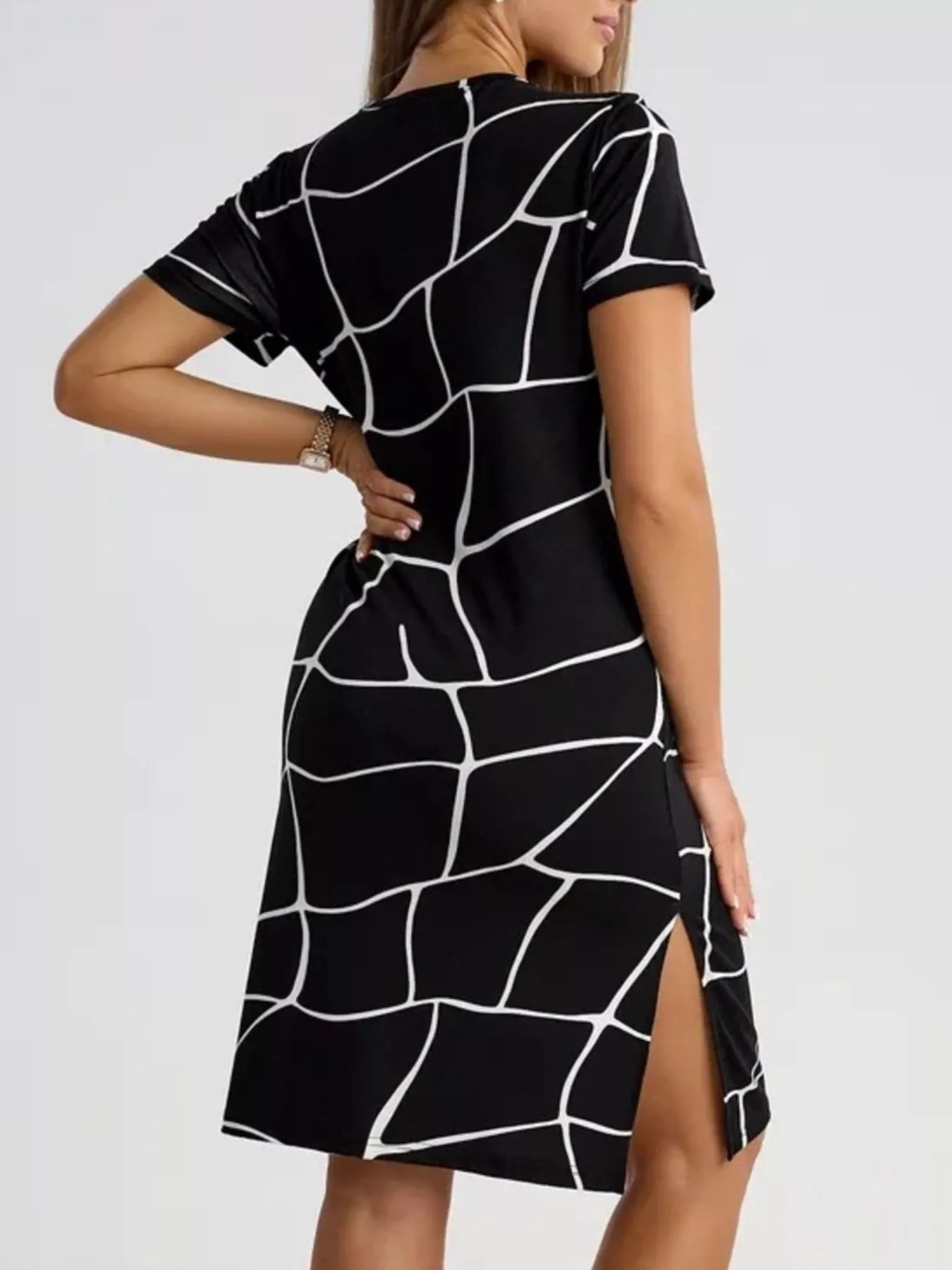 Black geometric print midi dress with crew neck and vented side