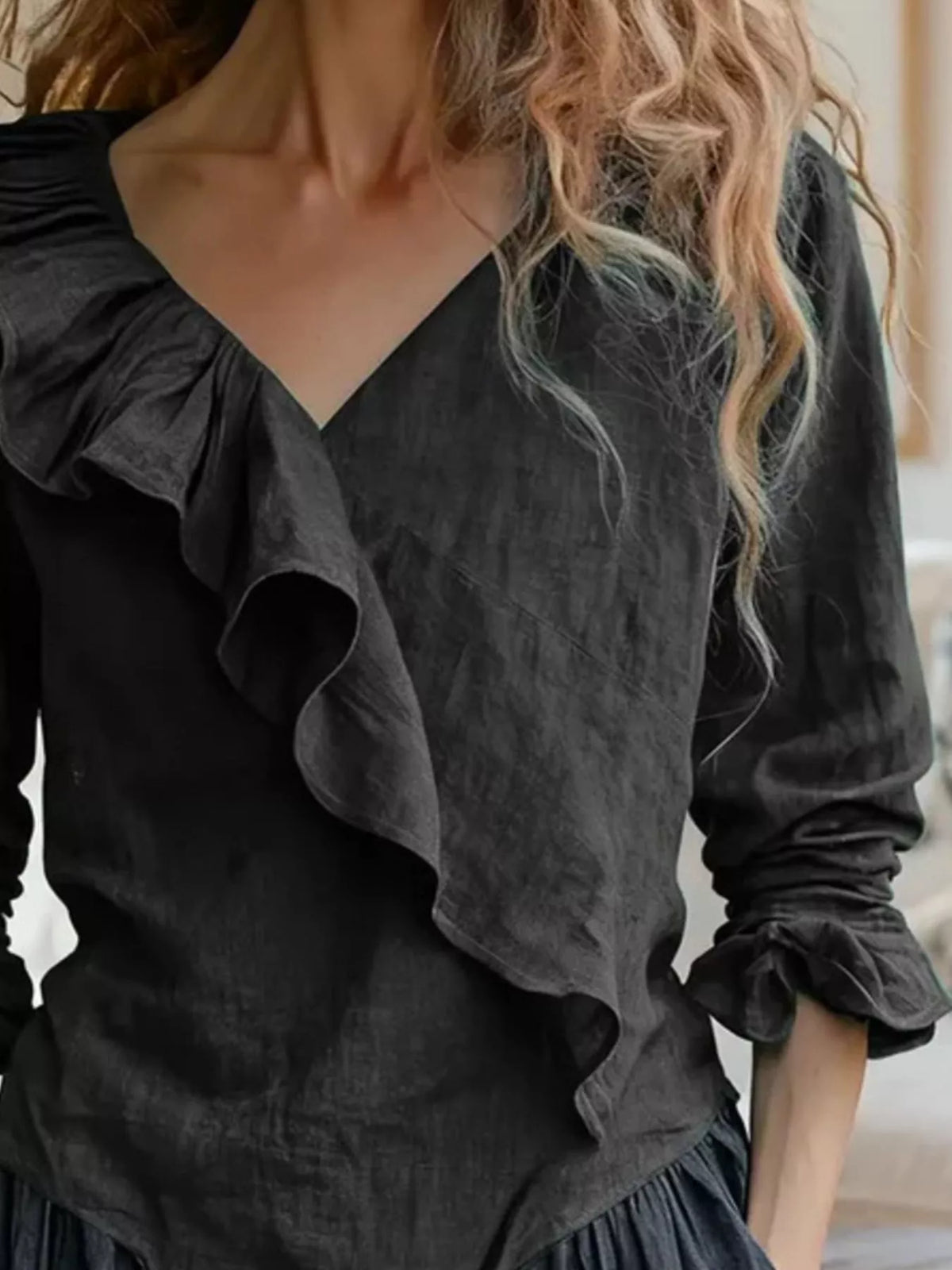 Ruffled V-neck long-sleeve blouse in black, layered ruffle front and cuffed sleeves