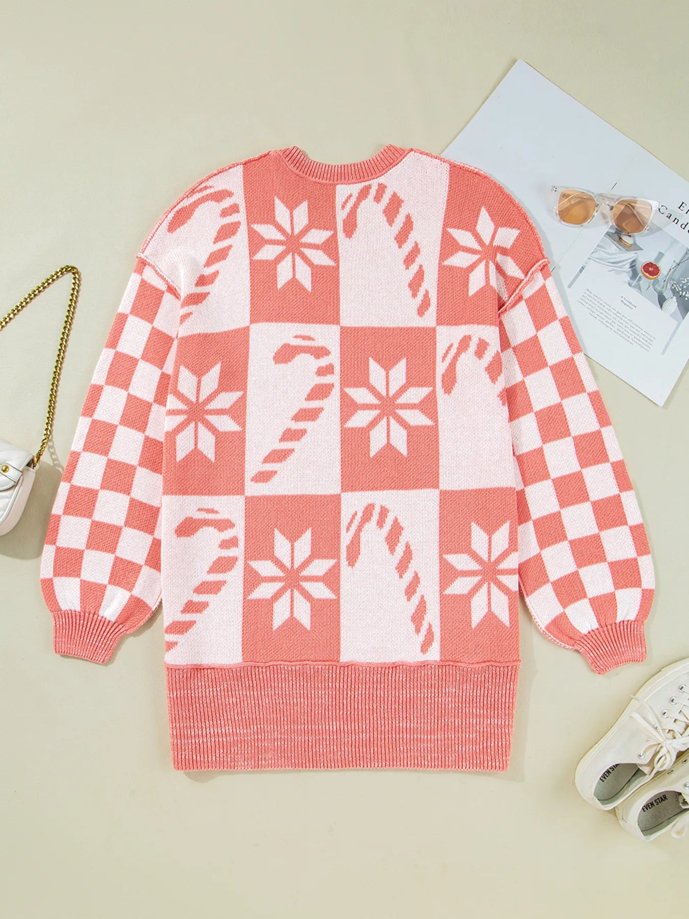 Burnt coral and white crew neck sweater with checker snowflake motif and ribbed hem
