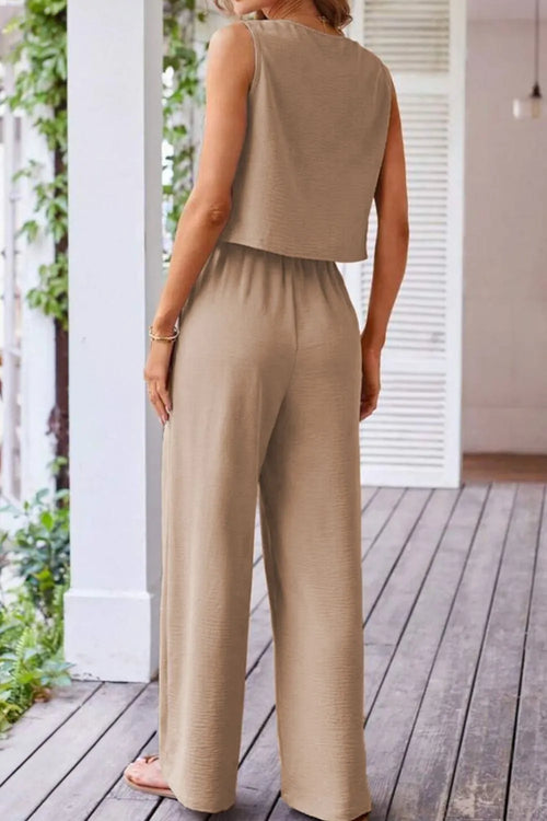 Camel drawstring wide-leg pants with sleeveless vest, shown from the back