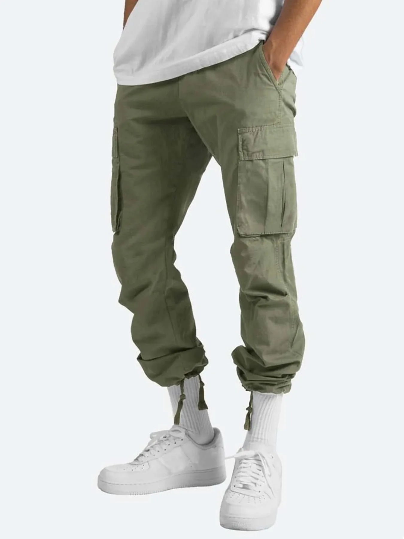 Men's green drawstring cargo pants with side cargo pockets and cuffed ankles.