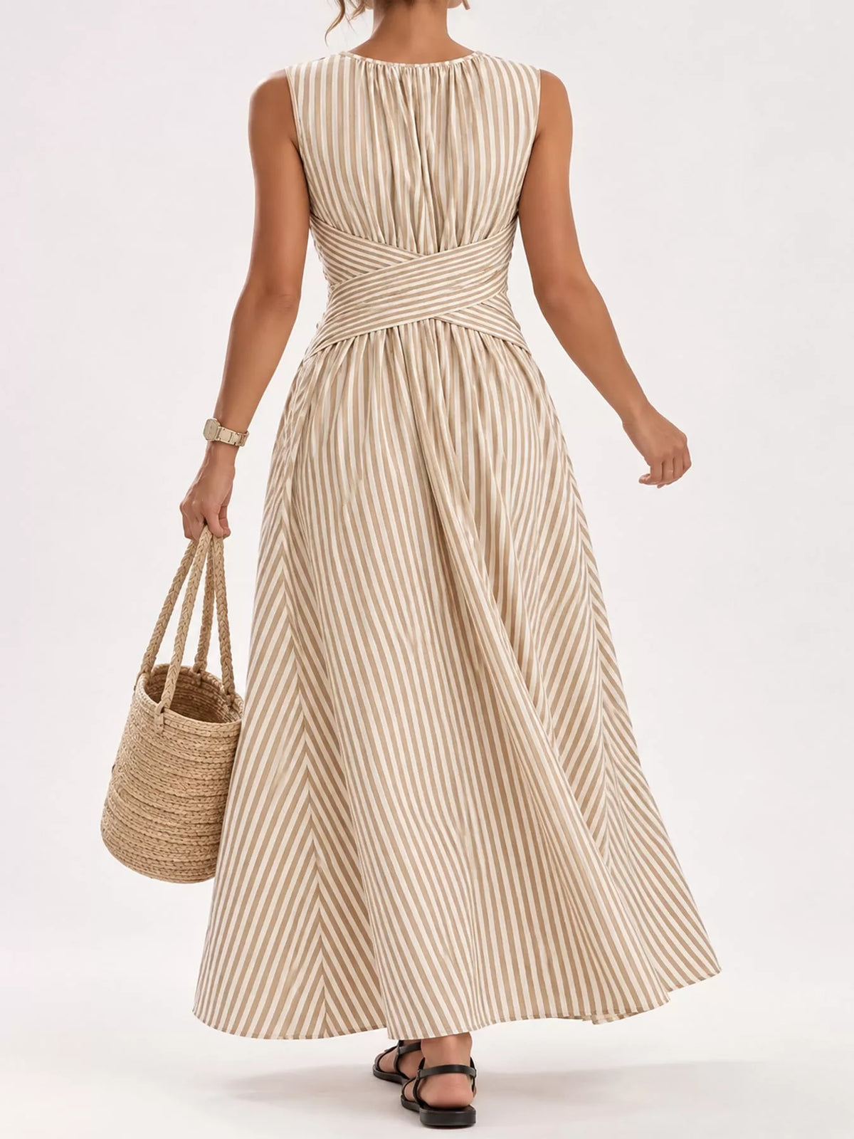 Beige striped sleeveless maxi dress from back view with crisscross waist detail