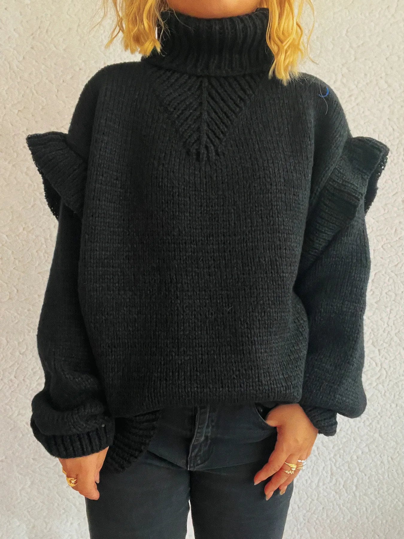 Ruffled turtleneck knit sweater, black, front view with chevron knit detail