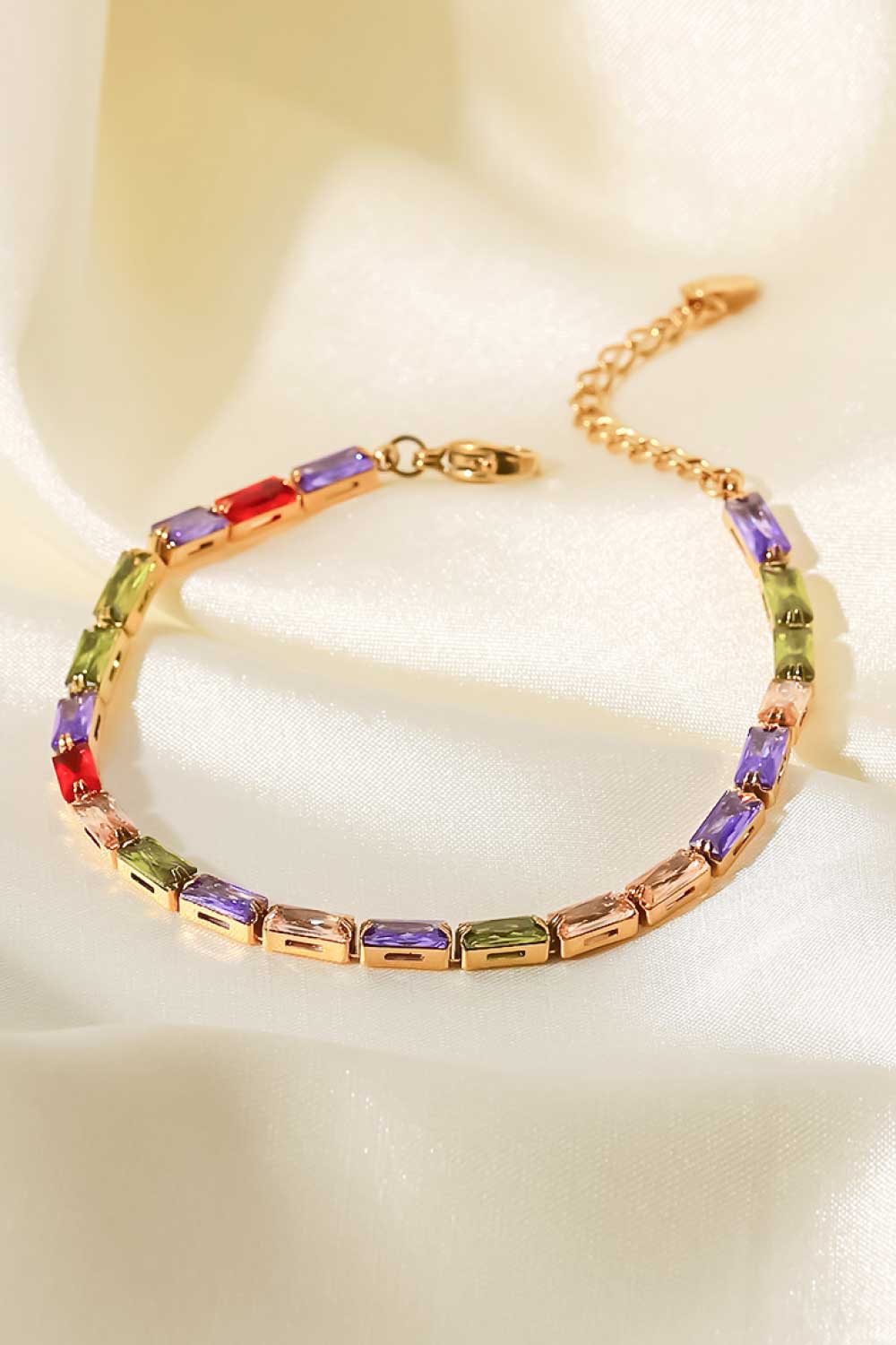 Gold-plated bracelet with multicolored cubic zirconia rectangular stones and extender loop