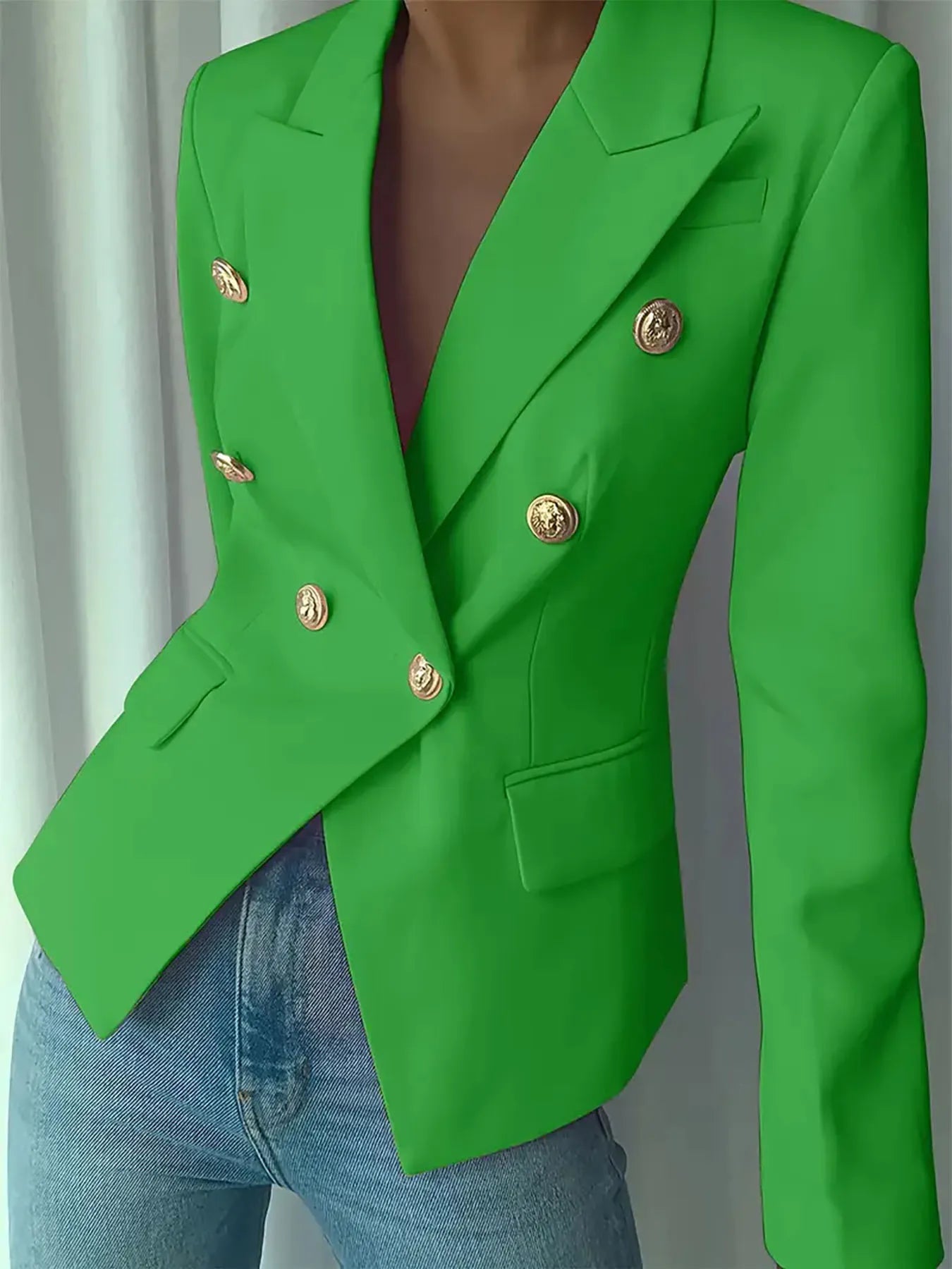 Green double-breasted blazer with notch lapel and gold decorative buttons front