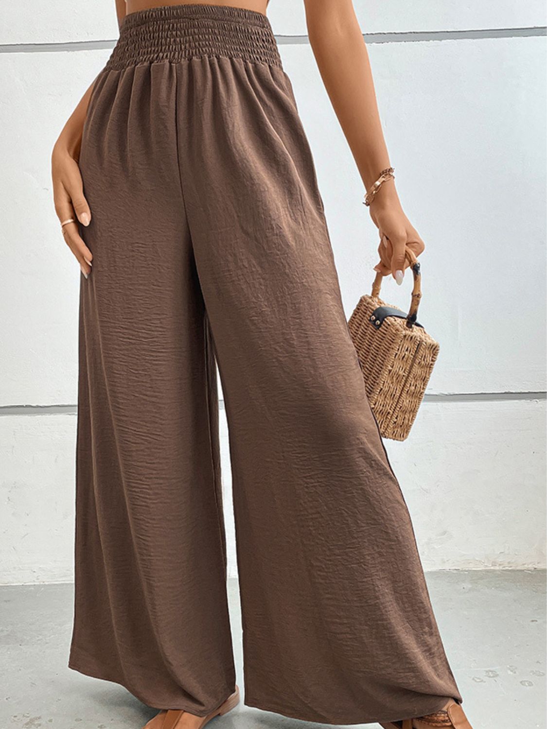 Brown wide-leg long pants with elastic waist and relaxed drape