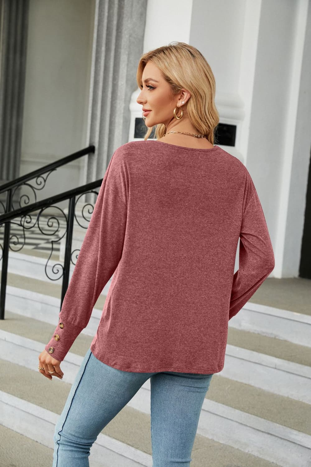 Cedar & Moore V-Neck Long Sleeve T-Shirt in dusty rose; back view of model wearing a knit top with cuff buttons.
