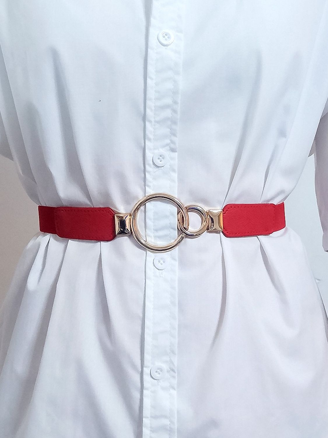 Red elastic vegan leather belt with double ring buckle and metal keeper tabs